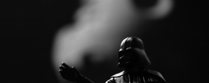 A minifigure of darthvader representing repression