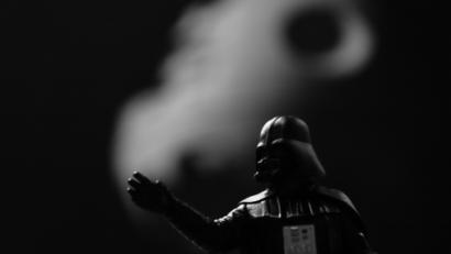 A minifigure of darthvader representing repression