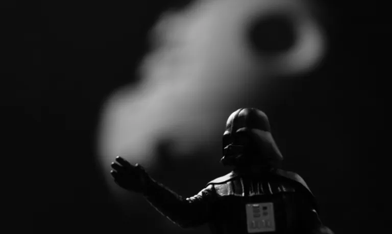 A minifigure of darthvader representing repression