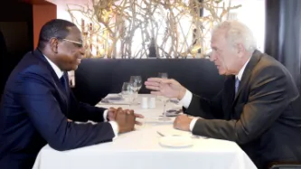 Two people talking over lunch